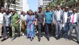 Members of the United Opposition march to the office of the Inspector General of Police on 30 January 2026.