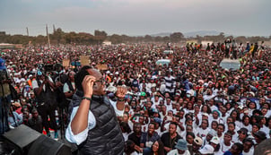 Zambian opposition leader Brian Mundubile addresses supporters at a political rally.