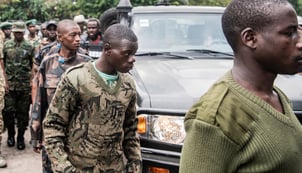 FDLR soldiers arrive at the Goma border crossing in the DRC on 1 March 2025 as part of their repatriation to Rwanda, organised by the AFC/M23.