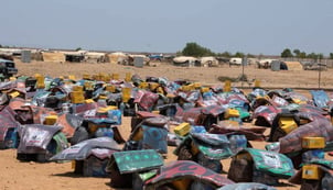Packages of humanitarian supplies are arranged before being distributed to people fleeing clashes between Houthi fighters and Saudi-backed Yemeni government forces, at the Markazi refugee camp after arriving in Djibouti, 18 September 2026.